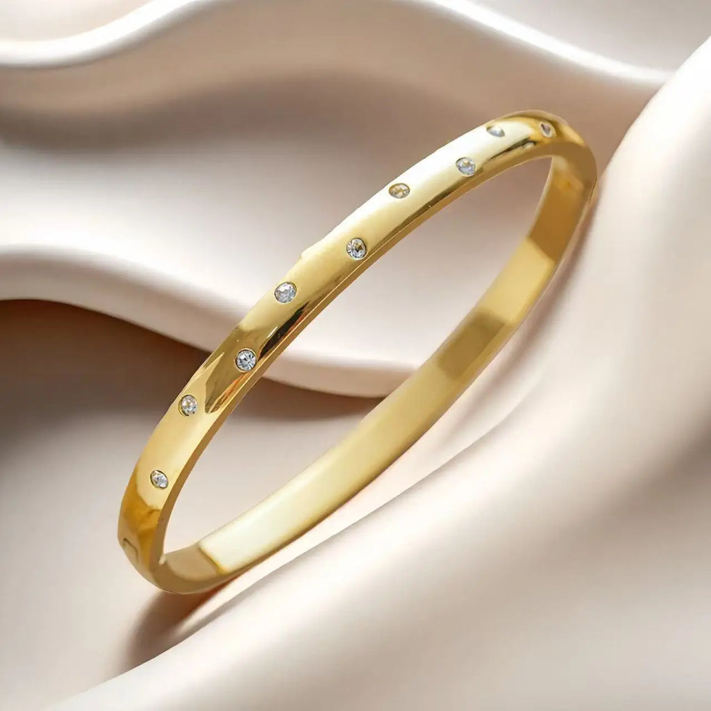Pulseira rígida Lumière de mulher em aço inoxidável com zircónias MotionCare