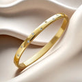 Pulseira rígida Lumière de mulher em aço inoxidável com zircónias MotionCare