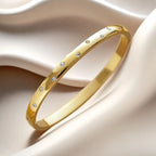 Pulseira rígida Lumière de mulher em aço inoxidável com zircónias MotionCare